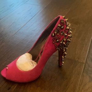 Spiked pink pumps